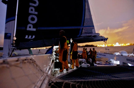 <i>Banque Populaire V</i> crosses the finish line, breaking the world circumnavigation record. Photo courtesy of BPCE.