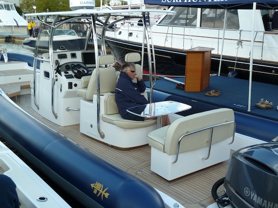 HBI's Bill Reed demonstrates the HBI 30's comfort factor, even on an overcast day at the boat show.