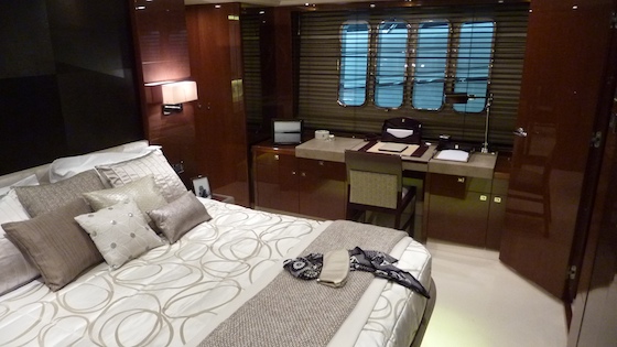 The master berth sits on centerline with writing desk to port and seating to starboard.