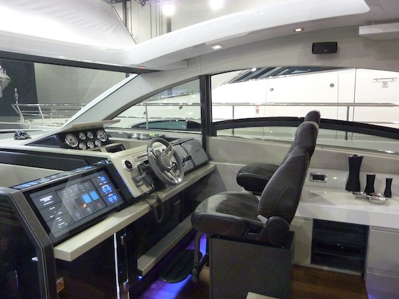 The helm station offers control and fresh air. Note the front of the 3-meter starboard side window in retracted position.